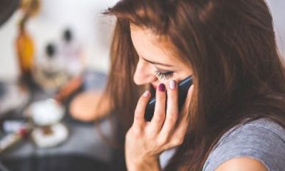 woman holding phone