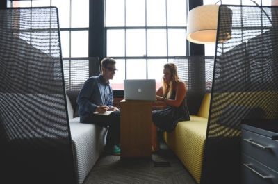 man and woman in meeting