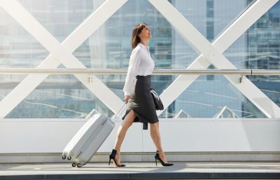 woman walking with suitcase