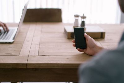 Person holding a mobile phone